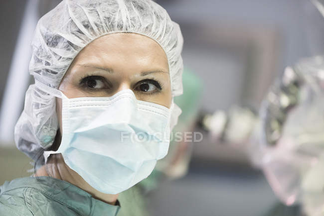 Portrait of operating room nurse looking aside — Stock Photo