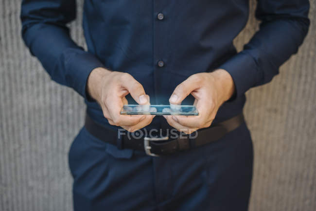 Cropped view of man holding colorful screen — Stock Photo