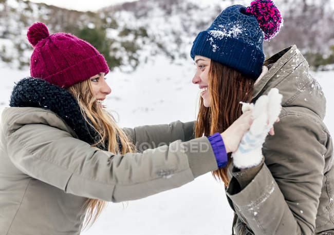 Asturias, Spain, two best friends having fun in the snow — Stock Photo