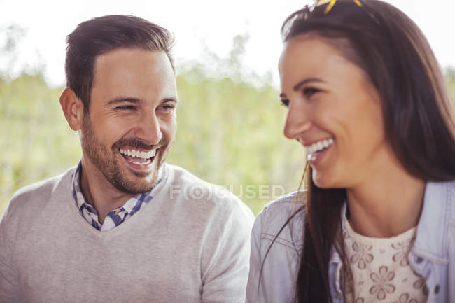 two people laughing together