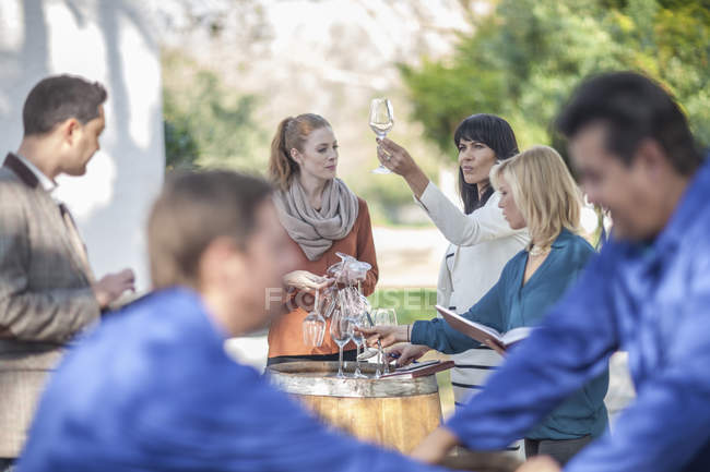 Group of sales people and wine workers outdoors — Stock Photo