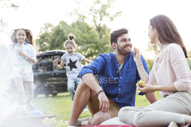 Happy family having a picnic at road trip — Stock Photo