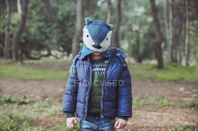 Boy wearing funny woolly hat in forest — Stock Photo