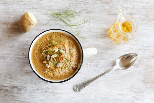 Vegetable creme soup with fennel, ginger root and sunflower seeds, top view — Stock Photo
