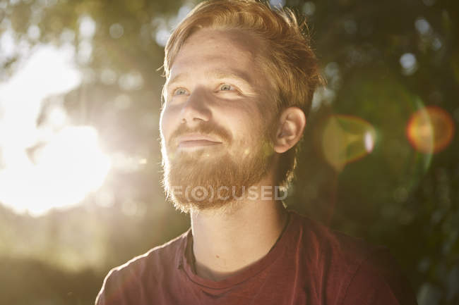 Smiling Young Man In Backlight Outdoors — 25 30 Years, One Person 