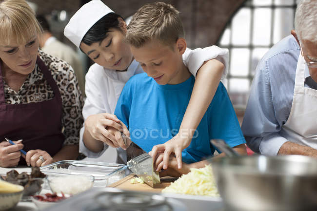 Happy cute siblings cooking in kitchen — Stock Photo