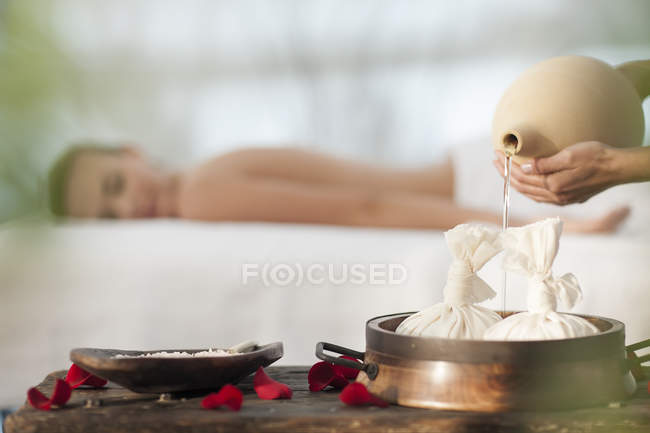 Massage oil is being poured — Stock Photo