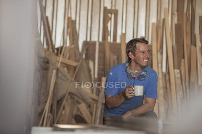 Carpenter on coffee break — Stock Photo