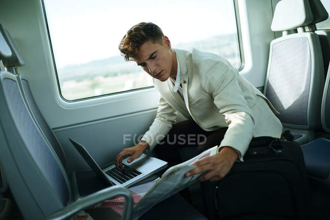 Young man using a laptop — Stock Photo