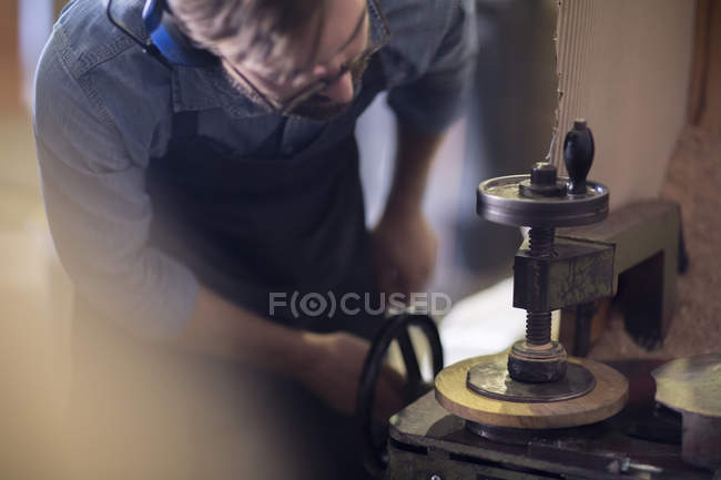 Close-up of cooper working on lathe in workshop — Stock Photo