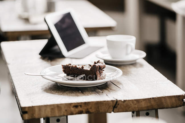 Piece Of Cake On Table In Cafe Business Cup Stock Photo