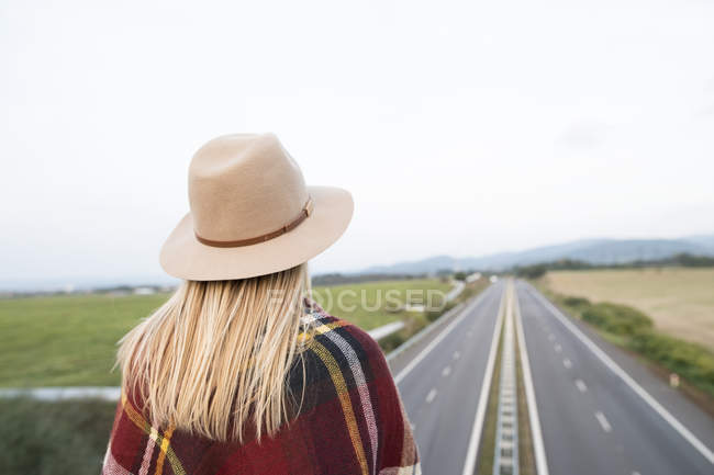 Woman looking at motorway — Stock Photo