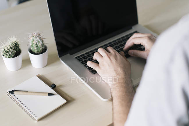 Close up of Man working on laptop computer — Stock Photo