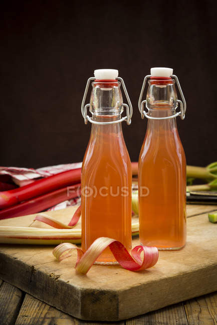 Bottles of homemade rhubarb juice — Stock Photo