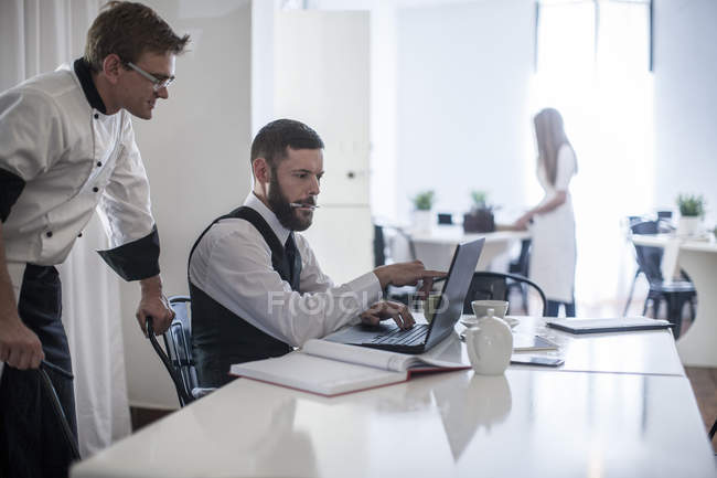 Restaurant manager and chef planning menu in modern restaurant — job,  Business People - Stock Photo | #177219518