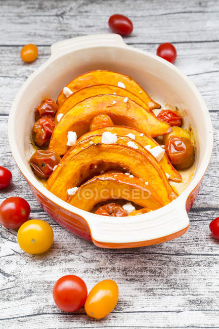 Pumpkin gratin with tomato and feta cheese — Stock Photo