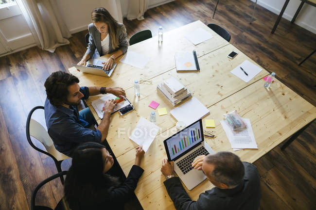 Business people having a team meeting in office — Stock Photo