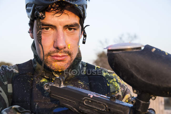 Portrait of a paintball player looking at camera — Stock Photo