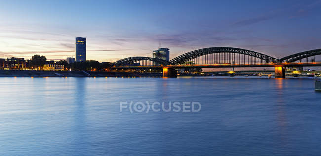 Germany, Cologne, view to KoelnTriangle and Hohenzollern Bridge at evening twilight — Stock Photo