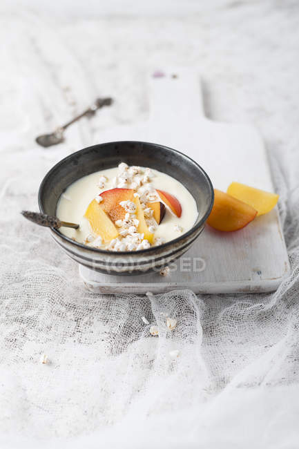 Yogurt with plums and puffed whole meal buckwheat — Stock Photo