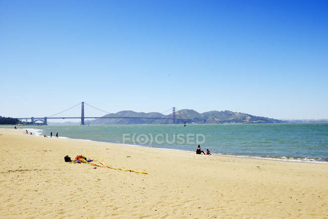 USA, California, San Francisco, Golden Gate Bridge and Fort Point as seen from Beach of Presidio — Stock Photo
