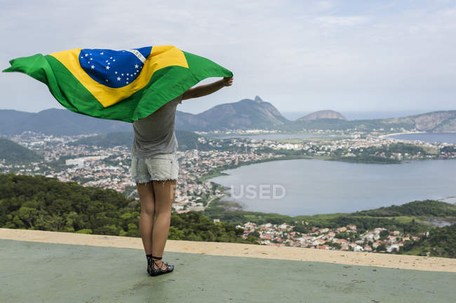 Brazil Woman With Brazilian Flag On A Viewpoint In Rio De Janeiro Patriotism Arms Outstretched Stock Photo