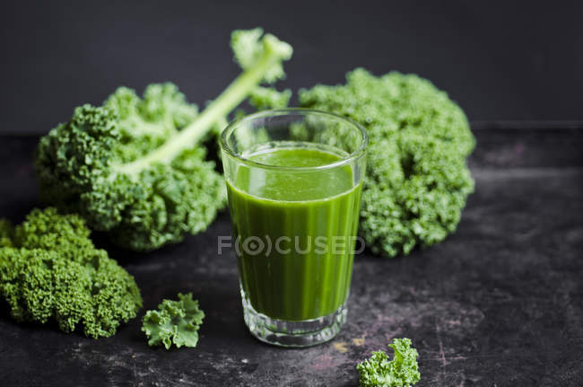 Glass of kale smoothie — Stock Photo