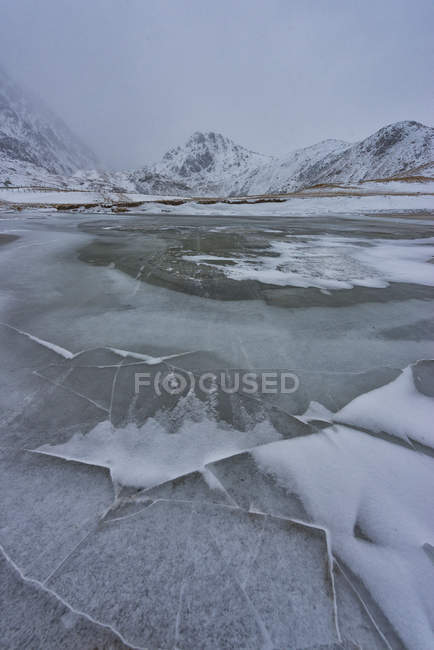 Norway, Lofoten, frozen lake in winter — Stock Photo