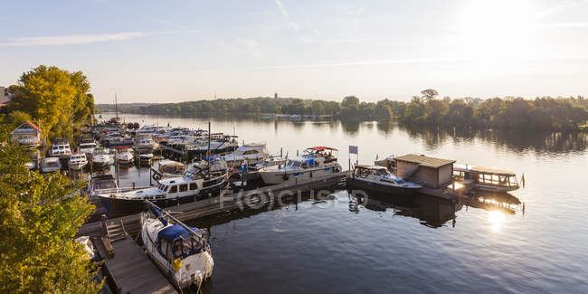 Germany, Potsdam, marina with boats over water — Stock Photo
