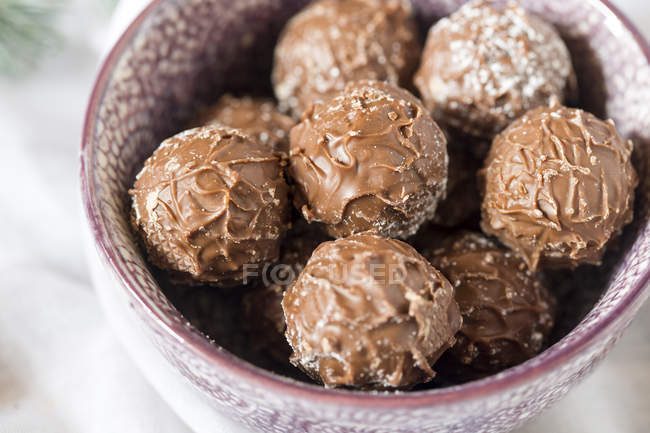 Close up of Bowl of chocolate truffles — Stock Photo