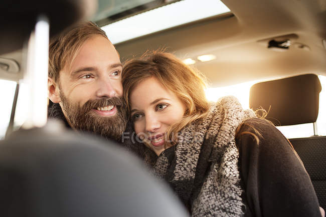 Couple cuddling in car — Stock Photo