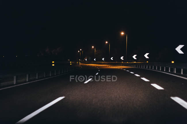 Italy, Udine, driving at night along the highway — Stock Photo