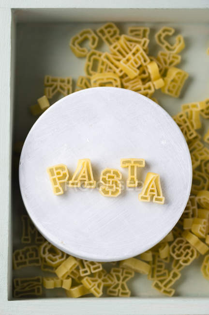 plate-with-pasta-letters-forming-the-word-pasta-elevated-view