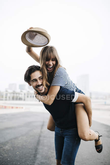 Man Giving Piggyback Ride To His Girlfriend Stock Photo - Image of  cheerful, person: 41022350