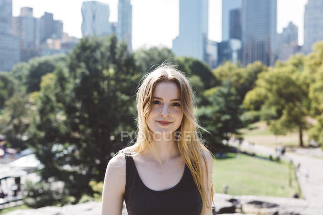 USA, New York City, portrait of young woman in Central Park — Stock Photo