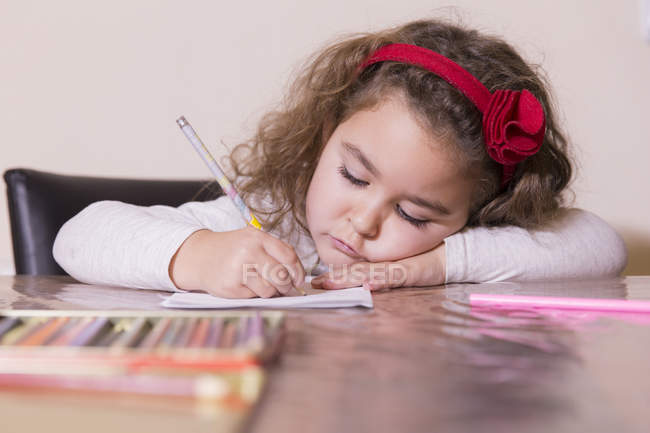 Portrait of focused drawing little girl — Stock Photo