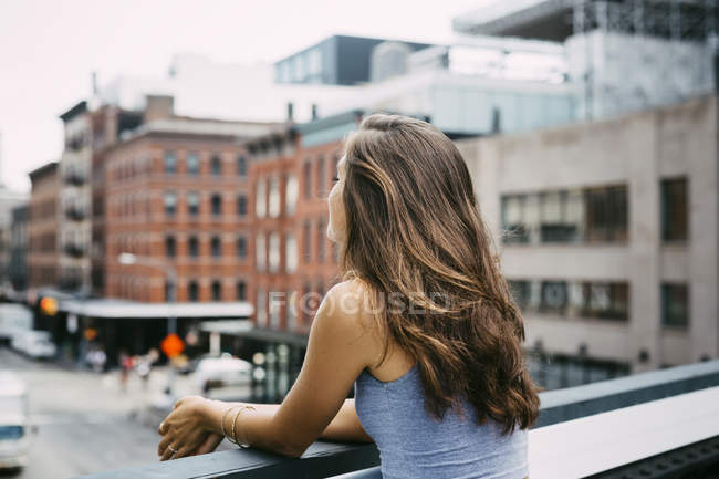 USA, New York City, young woman enjoying the view of the city — Stock Photo