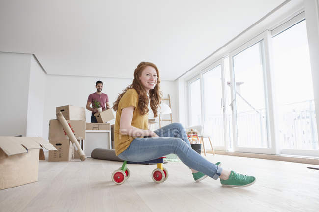 Girl riding toys mom