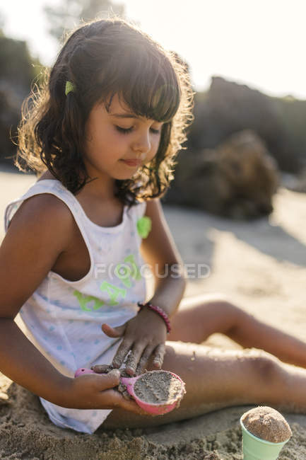 Little Playing With Sand On The Beach Color Image Brown Hair Little Playing With Sand On The Beach Stock Photo