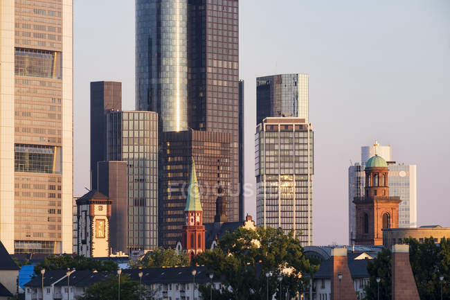Germany, Hesse, Frankfurt, Langer Franz, St Nicholas Church, St Paul's Church in front of high-rise building, financial district in the morning — Stock Photo