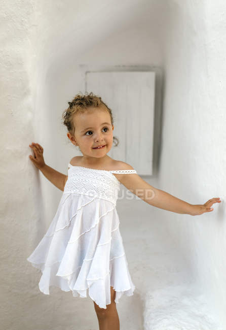 Toddler girl wearing white summer dress ...
