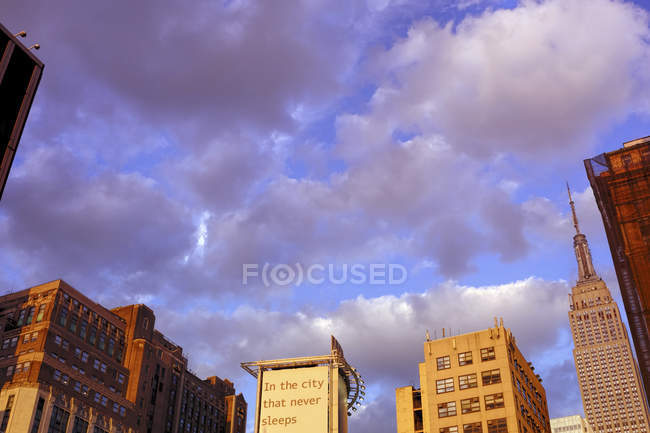 USA, New York City, Skyscrapers and advertising poster — Stock Photo