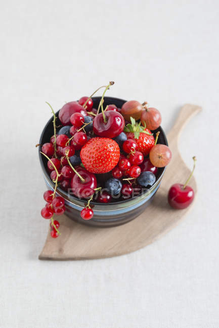 Bowl of different summer berries — Stock Photo
