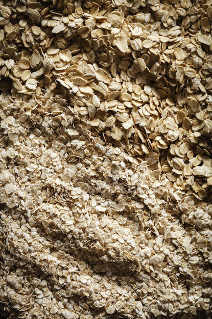 Closeup view of different oat flakes background — Stock Photo