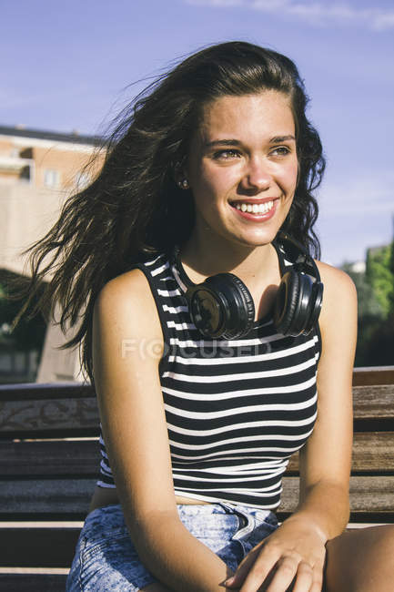 Portrait of smiling teenage girl with headphones — Stock Photo