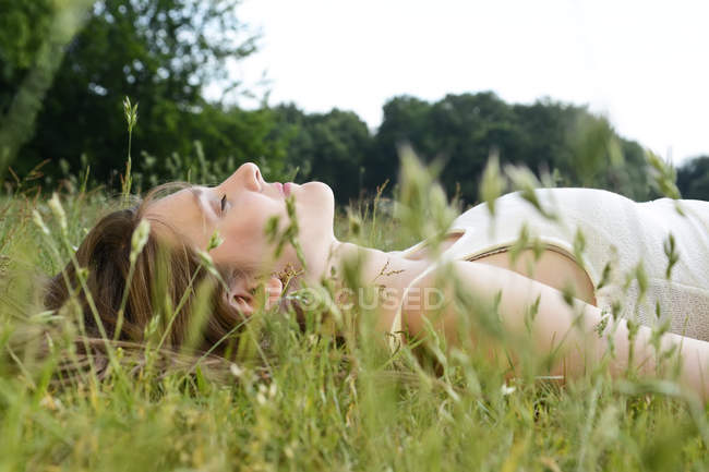 focused_179899736-stock-photo-young-woman-closed-eyes-lying.jpg