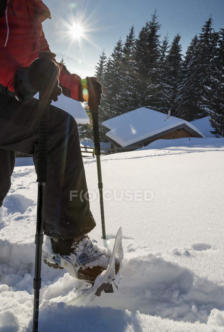 Austria, Tyrol, Schwaz, woman snowshoeing in the mountains — Stock Photo