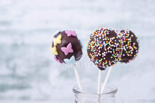 Chocolate cake pops garnished with nonpareils — Stock Photo