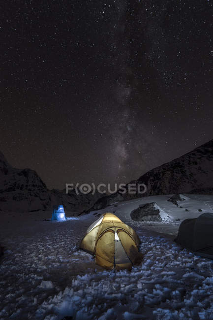 Nepal, Khumbu, Everest region, the milky way and tent from high camp on Pokalde peak at night — Stock Photo