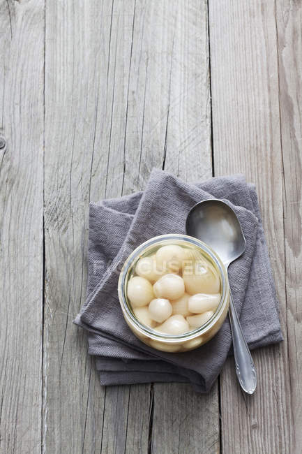 Preserving jar of pickled silverskin onions — Stock Photo